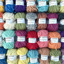 Load image into Gallery viewer, Eco-Bonbons in Nurturing Fibres Eco-Cotton, assorted colors, arranged in a grid